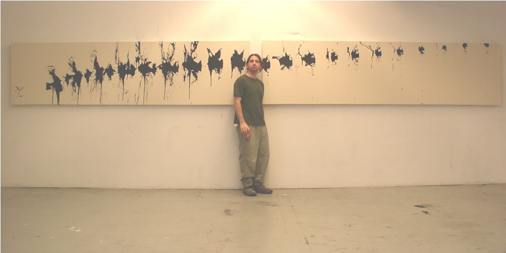 artist standing in front of 2 panel painting